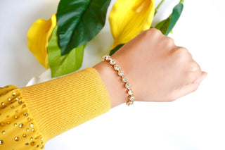 A bracelet with matching stud earrings 