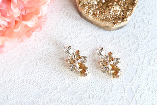 Gold white crystal earrings from divus india on Instagram